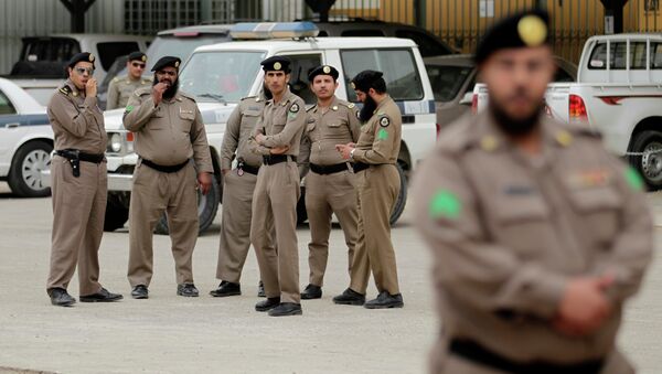 Saudi policemen form a check point near the site where a demonstration was expected to take place in Riyadh, Saudi Arabia, Friday, March 11, 2011 - Sputnik International
