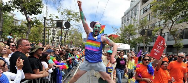 Benj Curtis jumps for joy during the annual Gay Pride Parade in San Francisco, California on June 28, 2015, two days after the US Supreme Court's landmark ruling legalizing same-sex marriage nationwide - Sputnik International