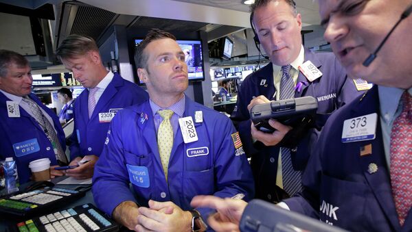 Traders Frank Masiello, center, and John Panin, right, talk about stock prices at the New York Stock Exchange, Tuesday, July 14, 2015 - Sputnik International