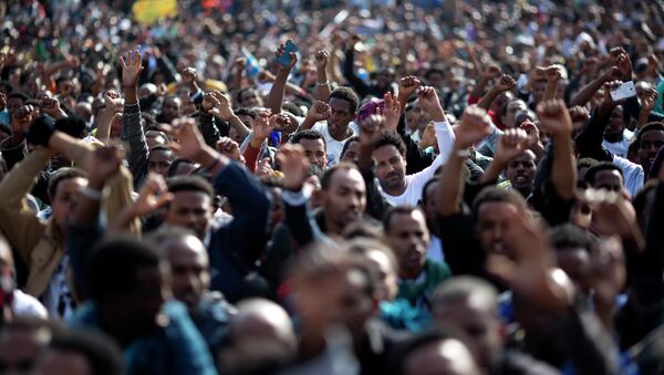 FILE - In this Sunday, Jan. 5, 2014 file photo, African migrants chant slogans during a protest in Rabin's square in Tel Aviv, Israel. Dozens of Africans have accepted an Israeli government offer to relocate to Uganda - Sputnik International