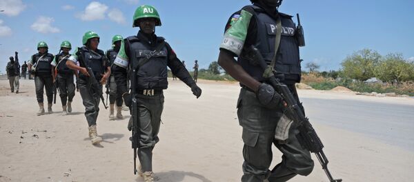 African Union Mission in Somalia (AMISOM) officers patrol around the Gashandhiga academy compound during celebrations of the 55th anniversary day of the Somali military force on April 12,2015 in Mogadishu African Union Mission in Somalia (AMISOM) officers patrol around the Gashandhiga academy compound during celebrations of the 55th anniversary day of the Somali military force on April 12,2015 in Mogadishu - Sputnik International