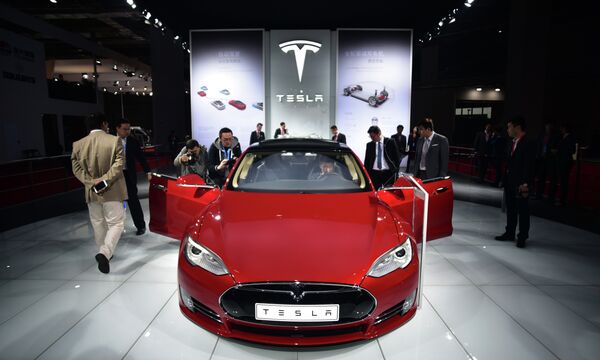 A Tesla Model S P85d car is displayed at the 16th Shanghai International Automobile Industry Exhibition in Shanghai on April 20, 2015 - Sputnik International
