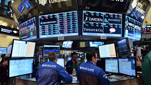 Stock specialists at the Barclays post work on the floor of the New York Stock Exchange just after the closing bell on July 3, 2013 in New York - Sputnik International