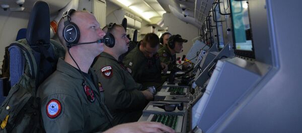 Crew members aboard a P-8A Poseidon. - Sputnik International