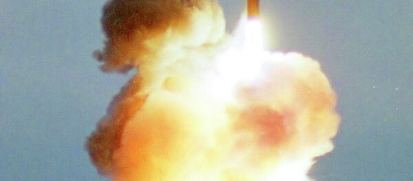 In this 2001 file photo an intercontinental ballistic Topol-M missile blasts off from an undisclosed location in Russia In this 2001 file photo an intercontinental ballistic Topol-M missile blasts off from an undisclosed location in Russia - Sputnik International