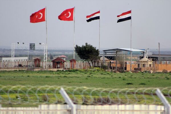 In this photo taken Tuesday, April 10, 2012, the border crossing between Turkey and Syria is seen from a refugee camp near the border, in Kilis , Turkey. In this photo taken Tuesday, April 10, 2012, the border crossing between Turkey and Syria is seen from a refugee camp near the border, in Kilis , Turkey. - Sputnik International