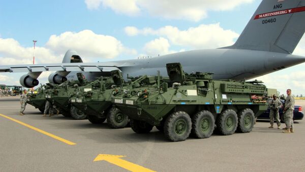 Elements from the Pennsylvania National Guard's 56th Stryker Brigade Combat Team arrive at Vilnius International Airport for participation in the multinational exercise Saber Strike 2014, June 7, 2014. - Sputnik International