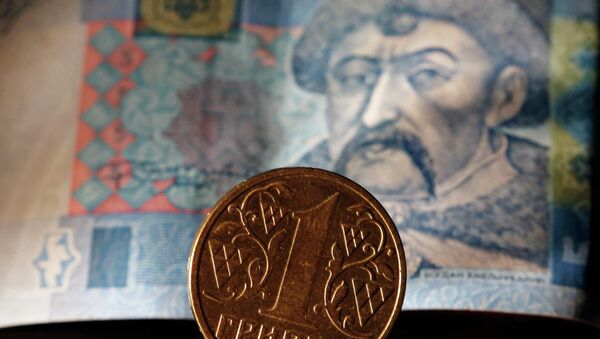 Ukrainian notes and hryvnia coin. - Sputnik International