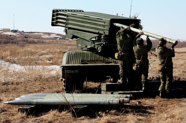 Troops load a Tornado multiple launch rocket system during the artillery drill of the 5th Army at Sergeyevsky base, Russia's Primorye Territory Troops load a Tornado multiple launch rocket system during the artillery drill of the 5th Army at Sergeyevsky base, Russia's Primorye Territory - Sputnik International