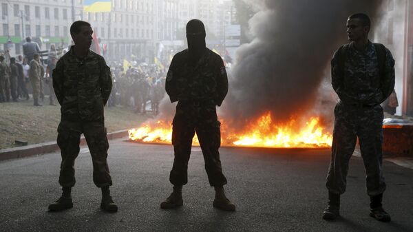 Tyres are set on fire during a rally held by members of the far-right radical group Right Sector, representatives of the Ukrainian volunteer corps and their supporters in central Kiev, Ukraine - Sputnik International