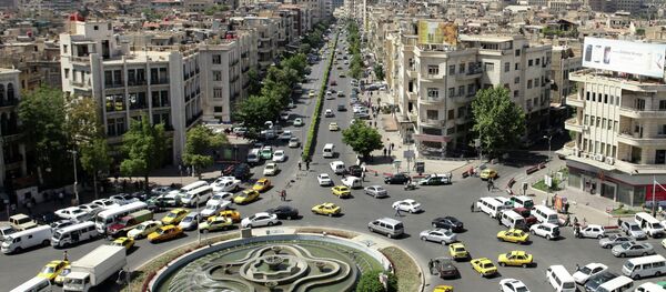 A general view shot taken on June 30, 2015, shows traffic on a roundabout in the Syrian capital Damascus A general view shot taken on June 30, 2015, shows traffic on a roundabout in the Syrian capital Damascus - Sputnik International
