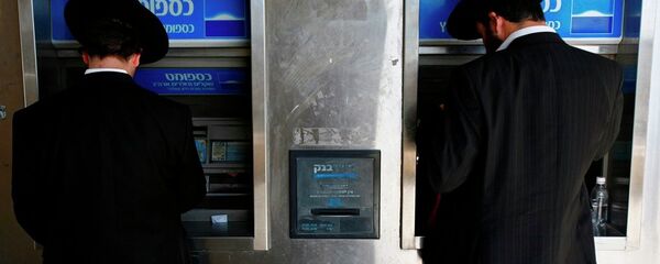 Two Ultra-Orthodox Jewish men take out money from a ATM machine in Jerusalem. Two Ultra-Orthodox Jewish men take out money from a ATM machine in Jerusalem. - Sputnik International