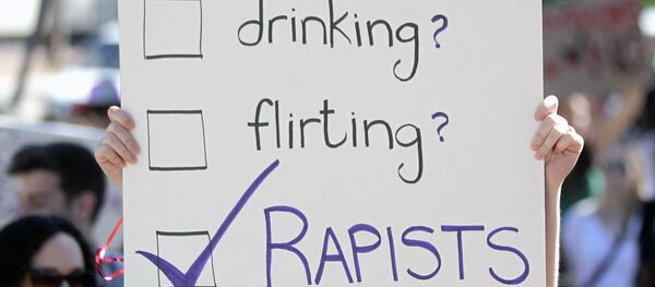 A woman carry a banner during a Slut Walk A woman carry a banner during a Slut Walk - Sputnik International