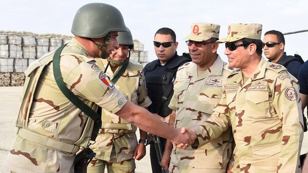 Egyptian President Abdel Fattah al-Sisi (R) greets members of the Egyptian armed forces, after travelling to the troubled northern part of the Sinai peninsula to inspect troops, in this July 4, 2015 handout picture courtesy of the Egyptian Presidency - Sputnik International