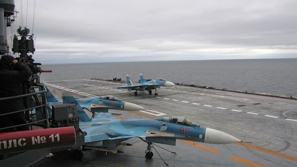 The Su-33s are seen aboard the Admiral Kuznetsov aircraft-carrying heavy cruiser. file photo. - Sputnik International