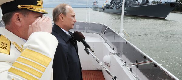 Russian President Vladimir Putin during the military parade held on the Day of the Russian Navy in the city of Baltiysk in Kaliningrad Region - Sputnik International