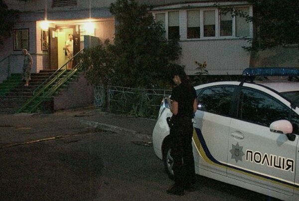 A police car stands outside Roman Nikolaev's home in Kiev. Nikolaev is in critical condition after being shot twice in the head on Saturday night. A police car stands outside Roman Nikolaev's home in Kiev. Nikolaev is in critical condition after being shot twice in the head on Saturday night. - Sputnik International
