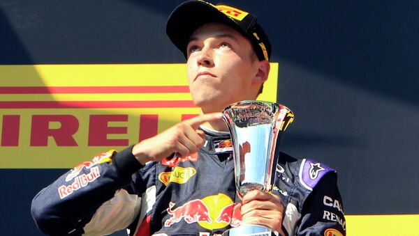 Second placed Red Bull Formula One driver Daniil Kvyat of Russia points to his cup after the Hungarian F1 Grand Prix at the Hungaroring circuit, near Budapest, Hungary July 26, 2015 - Sputnik International