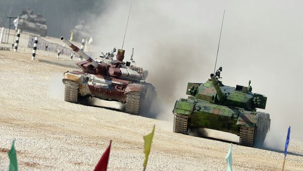 From right: Chinese and Russian crews ride Type 96A and T-72B tanks during a pursuit race of the Tank Biathlon 2014 World Championships at a training center of the Second Guards Taman Motorized Rifle Division in the town of Alabino - Sputnik International