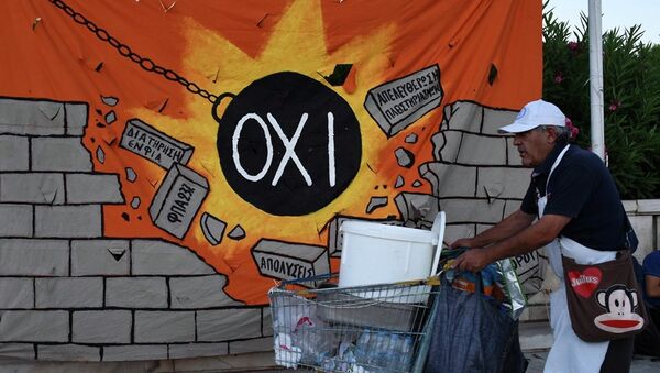 A street vendor pushes his trolley as he passes a banner, depicting a wrecking ball that reads: NO and destroying a wall with anti-austerity measures, in Athens, Wednesday, July 22, 2015. - Sputnik International