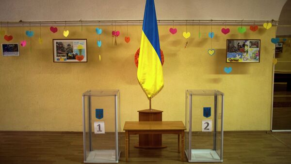 Ballot boxes await use inside a polling station in central Kiev, Ukraine, Friday, Oct. 24, 2014 - Sputnik International