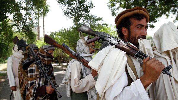 Taliban fighters hold their heavy and light weapons before surrendering them to Afghan authorities in Jalalabad, east of Kabul, Afghanistan. File photo - Sputnik International
