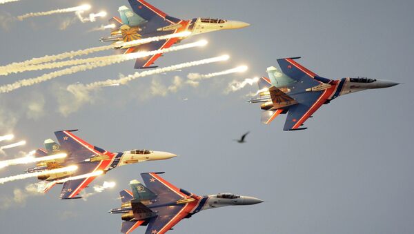 Russian Knights aerobatic team of four Su-27 jet fighters performing at  a MAKS international air show. file photo - Sputnik International