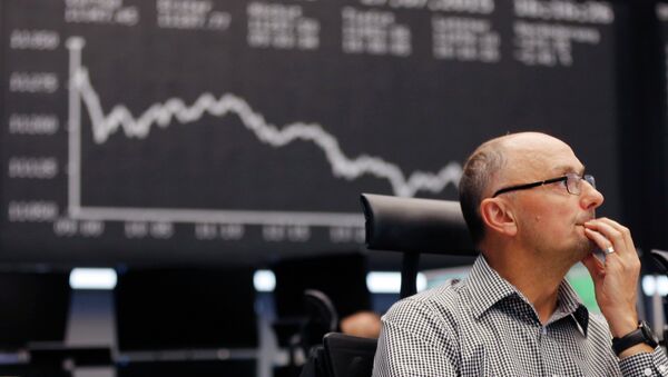A trader watches his screens at the stock market in Frankfurt, Germany - Sputnik International