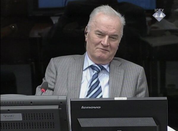 In this image taken from video former Bosnian Serb army commander Gen. Ratko Mladic smiles during his appearance at the Yugoslav war crimes tribunal Tuesday Jan. 28, 2014 in the Hague Netherlands - Sputnik International
