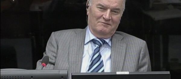 In this image taken from video former Bosnian Serb army commander Gen. Ratko Mladic smiles during his appearance at the Yugoslav war crimes tribunal Tuesday Jan. 28, 2014 in the Hague Netherlands - Sputnik International