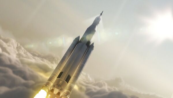 Artist's concept showing the 77-ton configuration of NASA’s Space Launch System rocket launching into space. - Sputnik International
