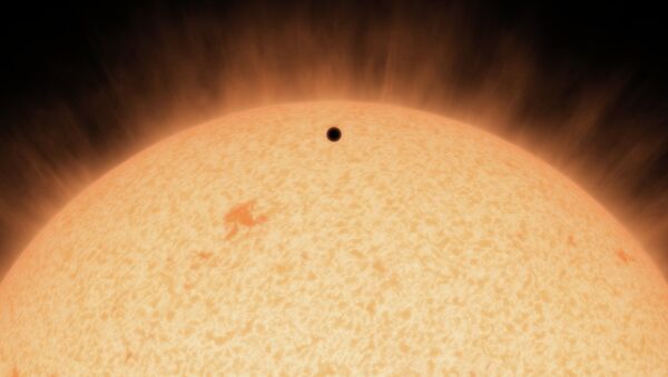 This artist's concept shows the silhouette of a rocky planet, dubbed HD 219134b. - Sputnik International