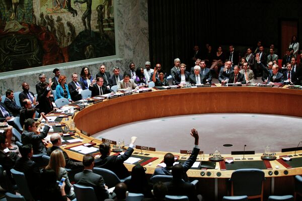Members of UN Security Council vote on a draft resolution for establishing a tribunal to prosecute those responsible for the MH17 flight during a Security Council meeting at United Nations Headquarters in New York on July 29, 2015. - Sputnik International