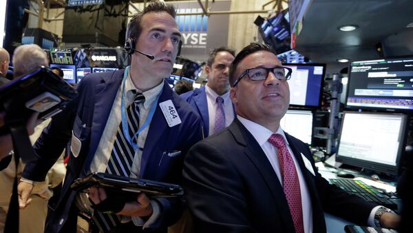 Trader Gregory Rowe, left, and specialist Paul Cosentino, right, work on the floor of the New York Stock Exchange - Sputnik International