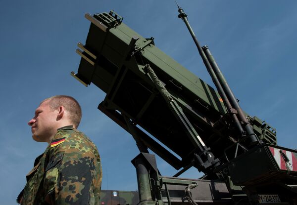 Picturen taken on March 25, 2014, shows a German soldier standing to attention in front of a German Patriot missile launcher at the Gazi barracks in Kahramanmaras, southern Turkey Picturen taken on March 25, 2014, shows a German soldier standing to attention in front of a German Patriot missile launcher at the Gazi barracks in Kahramanmaras, southern Turkey - Sputnik International