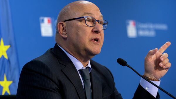 French Finance Minister Michel Sapin speaks during a media conference at the EU Council building in Brussels - Sputnik International