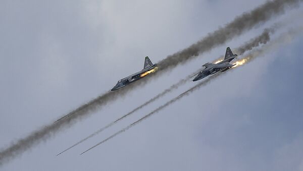 Russian Sukhoi Su-25 Frogfoot ground-attack planes perform during the Aviadarts military aviation competition at the Dubrovichi range near Ryazan, Russia, August 2, 2015 - Sputnik International