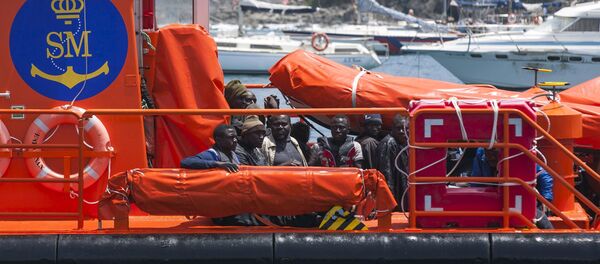 African migrants rest on board a Spanish rescue boat after arriving at Arguineguin port in the Canary Island Gran Canaria, Spain, July 13, 2015 African migrants rest on board a Spanish rescue boat after arriving at Arguineguin port in the Canary Island Gran Canaria, Spain, July 13, 2015 - Sputnik International
