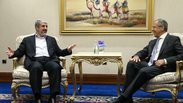 Russian Foreign Minister Sergei Lavrov, right, during a meeting with Chairman of the Hamas Political Bureau Khaled Mashal in Doha - Sputnik International