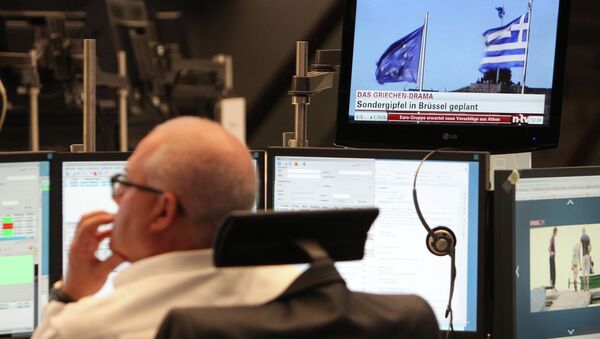 A trader works as news about Greece is seen on TV at the stock exchange in Frankfurt am Main, central Germany, on July 6, 2015 - Sputnik International
