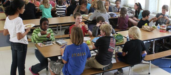 Students eat lunch at a school cafeteria. Students eat lunch at a school cafeteria. - Sputnik International