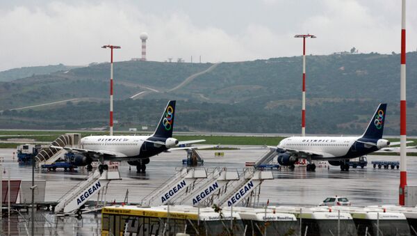 In this Wednesday, Dec. 15, 2010 file photo, planes are grounded during a 24-hour strike at the Athens International Airport Eleftherios Venizelos - Sputnik International