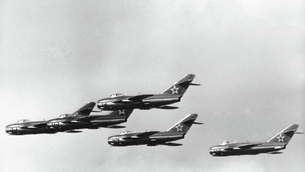 Russian MIG 15 jet fighters during a demonstration at the East German Air Force Sports and Cultural Festival, at Cottbus, East Germany, on Sept. 3, 1957 - Sputnik International