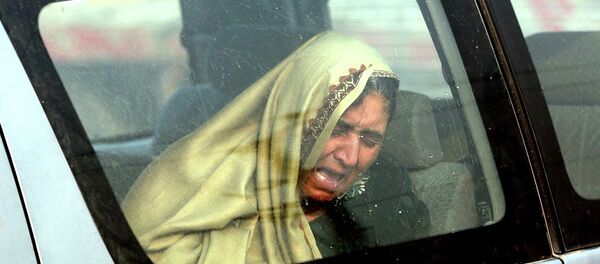 An Afghan woman cries at the site of a suicide attack in Kabul, Afghanistan Monday, Jan. 5, 2015. - Sputnik International