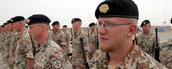 Danish soldiers stand guard during a ceremony to mark transfer of control of a British military base, in Basra, Iraq, Tuesday, April 24, 2007 Danish soldiers stand guard during a ceremony to mark transfer of control of a British military base, in Basra, Iraq, Tuesday, April 24, 2007 - Sputnik International