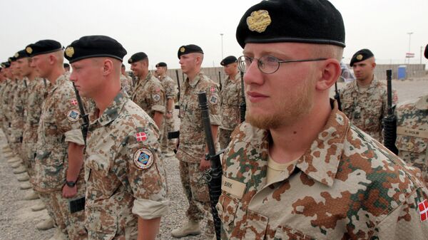 Danish soldiers stand guard during a ceremony to mark transfer of control of a British military base, in Basra, Iraq, Tuesday, April 24, 2007 - Sputnik International