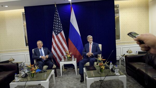 Russia's Foreign Minister Sergei Lavrov (L) and U.S. Secretary of State John Kerry sit next to each other before a bilateral meeting in Kuala Lumpur, Malaysia August 5, 2015 - Sputnik International