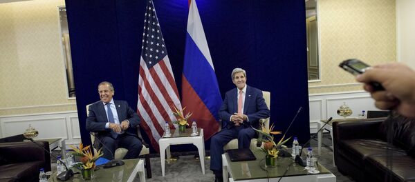 Russia's Foreign Minister Sergei Lavrov (L) and U.S. Secretary of State John Kerry sit next to each other before a bilateral meeting in Kuala Lumpur, Malaysia August 5, 2015 - Sputnik International