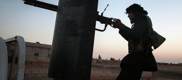 A member of the Islamic Kurdish Front aims at a position of fellow Kurdish fighters from the Committees for the Protection of the Kurdish People (YPG) during clashes with the militia, reportedly set up to protect the Kurdish areas in Syria from opposing forces, on the outskirts of the northern Syrian city of Raqqa A member of the Islamic Kurdish Front aims at a position of fellow Kurdish fighters from the Committees for the Protection of the Kurdish People (YPG) during clashes with the militia, reportedly set up to protect the Kurdish areas in Syria from opposing forces, on the outskirts of the northern Syrian city of Raqqa - Sputnik International