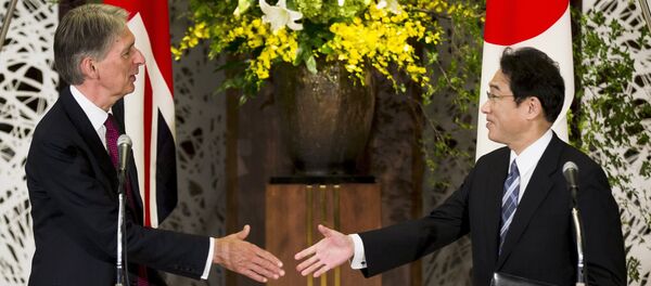 Japan's Foreign Minister Fumio Kishida (R) shakes hands with British Foreign Secretary Philip Hammond after a news conference about the 4th UK-Japan Strategic Dialogue at Iikura House in Tokyo Japan's Foreign Minister Fumio Kishida (R) shakes hands with British Foreign Secretary Philip Hammond after a news conference about the 4th UK-Japan Strategic Dialogue at Iikura House in Tokyo - Sputnik International